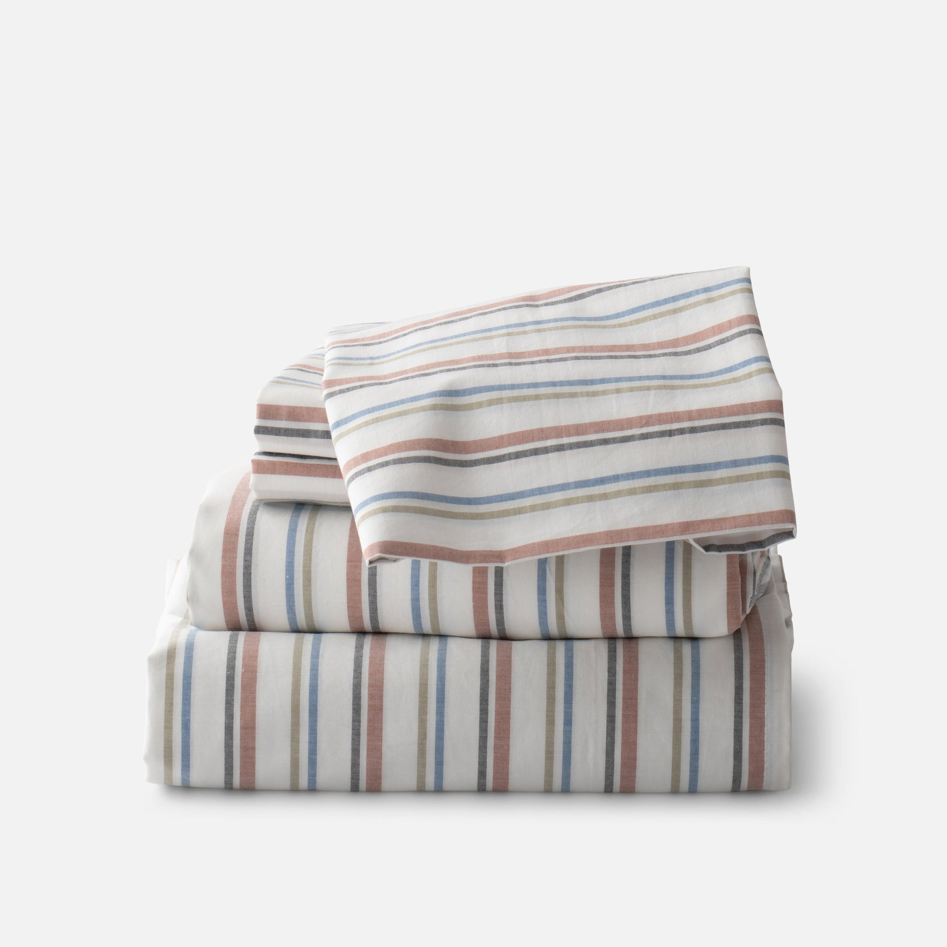 Stacked Fresh Stripe Percale sheeting showcasing tawny, olive, indigo, and black yarn-dyed stripes on a soft gray background