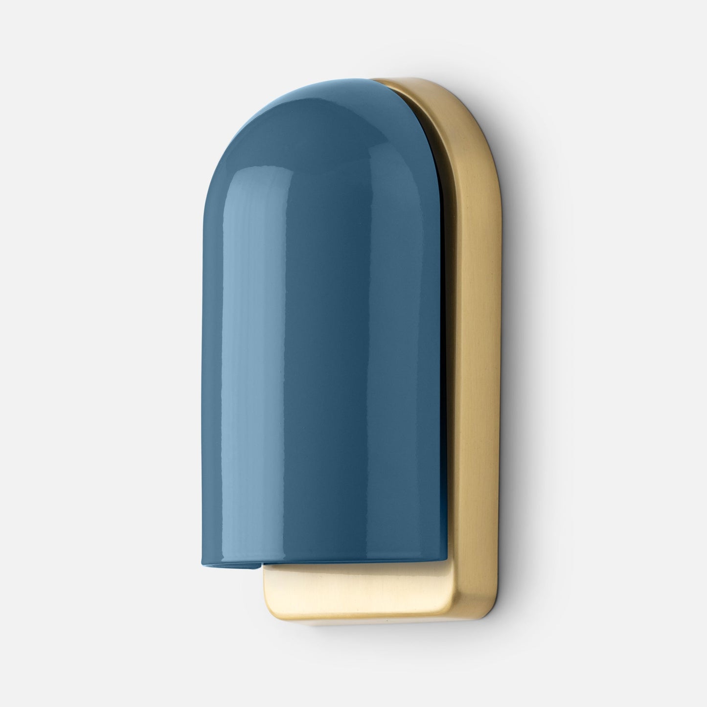 Close-up side view of Allegheny Slim Sconce showing glossy blue rounded shade and antique brass backplate on white background