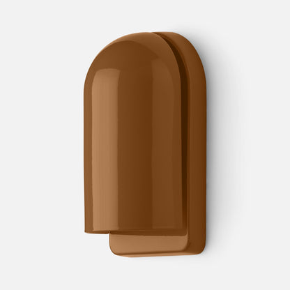 Close-up of Allegheny Slim Sconce showing glossy rounded shade and slim backplate in brown on a white background