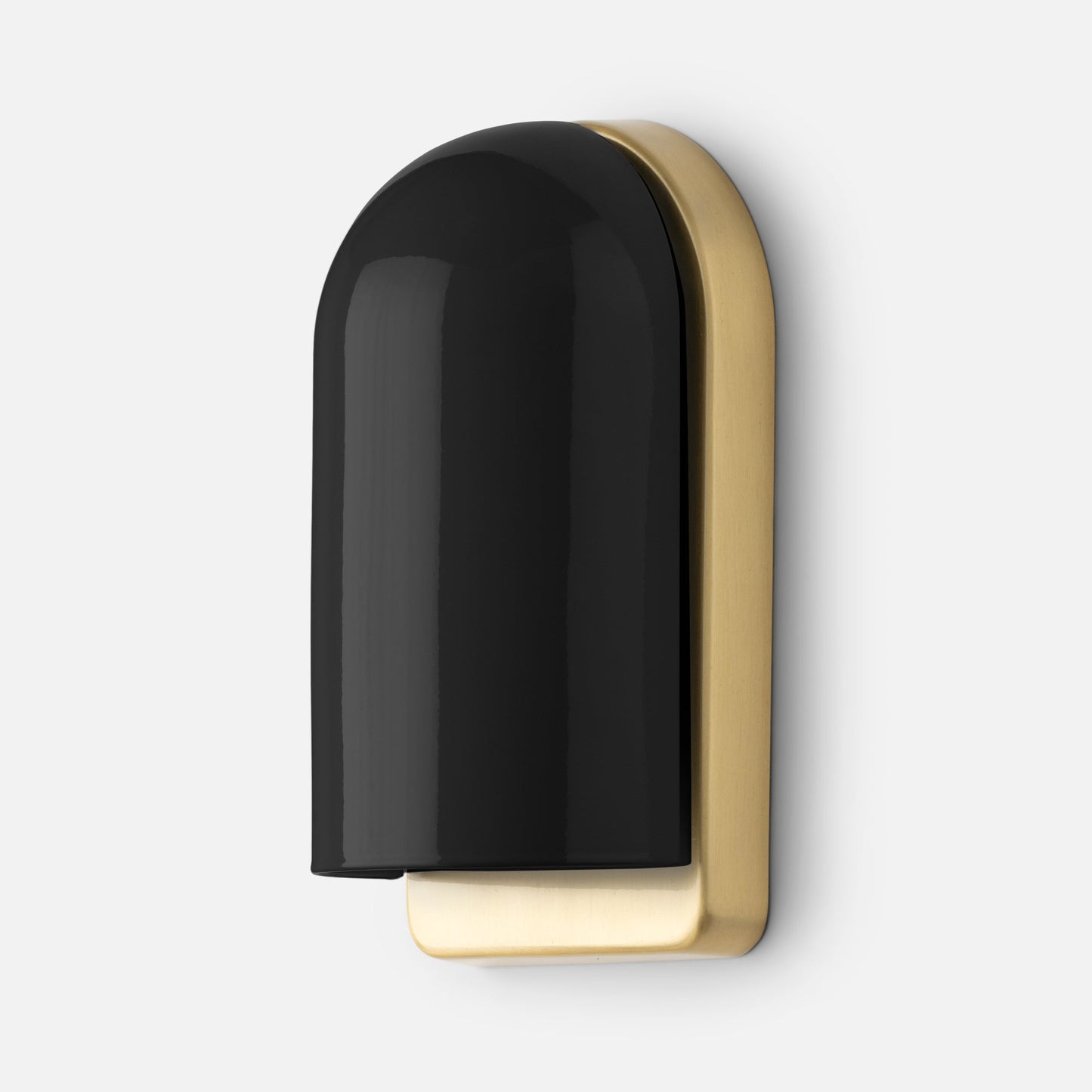 Close-up angled view of Allegheny Slim Sconce showcasing glossy black dome shade and brushed brass backplate on a white wall