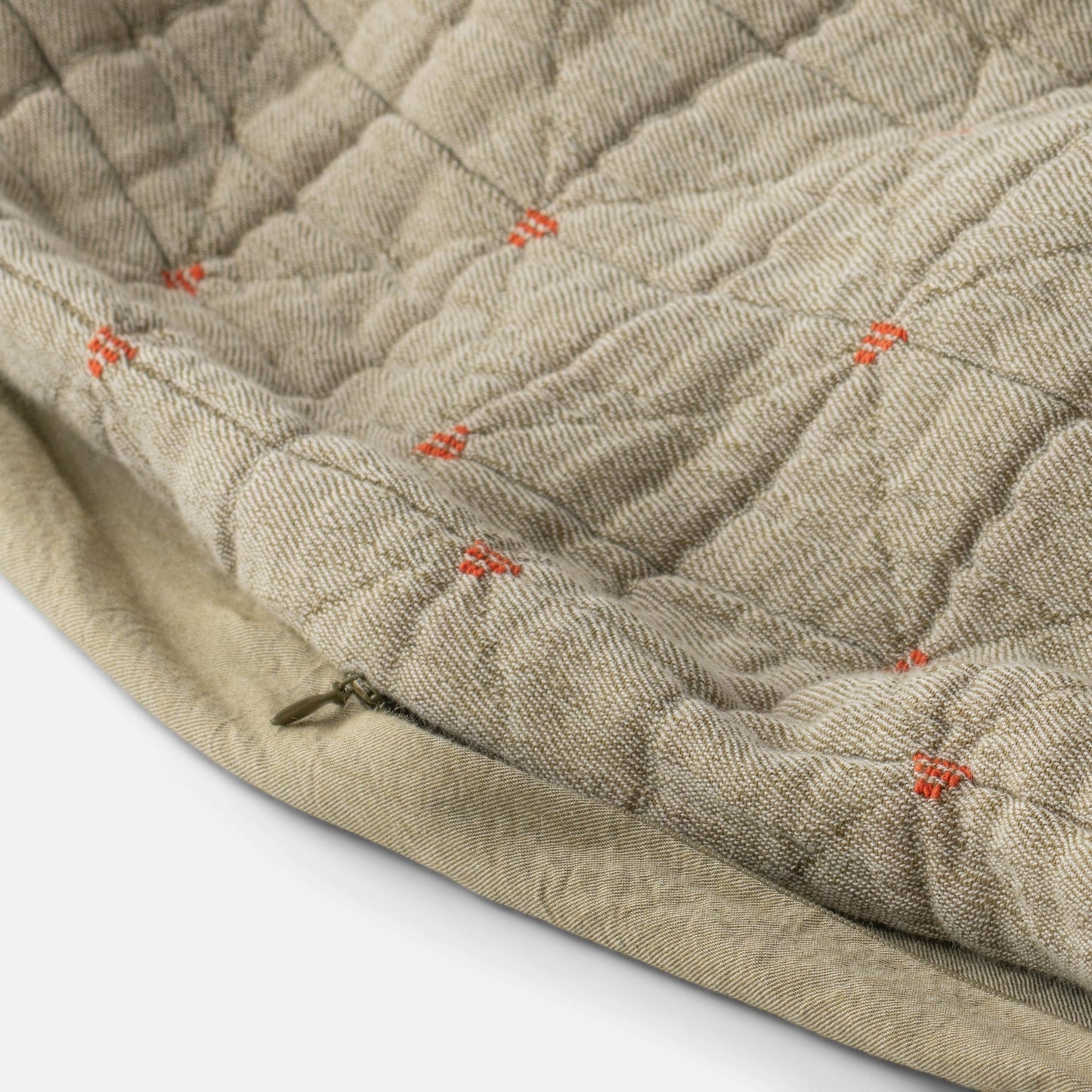 Close-up of Peak Stitch Duvet showing triangular quilting, yarn-dyed matelassé texture, red stitch ties and hidden zipper