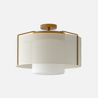 Front close-up of Swell 20-inch flush mount with perforated metal shade, mustard frame and opal diffuser